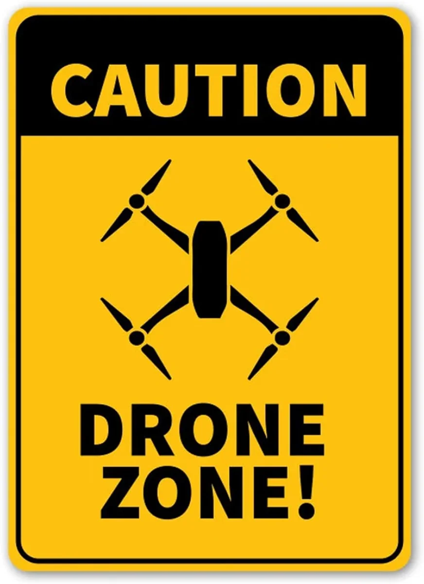 Yellow and black Caution Drone Zone metal sign